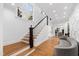 Welcoming entryway with staircase, hardwood floors, and view to the living room at 330 Tenney Circle, Chapel Hill, NC 27514