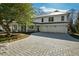 Two-story home showcasing a paved driveway, attached garages and manicured landscaping at 330 Tenney Circle, Chapel Hill, NC 27514