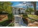Beautiful two-story home with manicured landscaping, a metal roof, and a welcoming entrance at 330 Tenney Circle, Chapel Hill, NC 27514