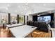 Spacious game room with ping pong table, golf simulator, and comfortable seating, perfect for entertainment at 330 Tenney Circle, Chapel Hill, NC 27514