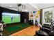 Entertainment room with a golf simulator and theater seating for recreation at 330 Tenney Circle, Chapel Hill, NC 27514