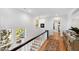Upstairs hallway with hardwood floors, natural light, and rug at 330 Tenney Circle, Chapel Hill, NC 27514