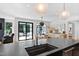 Kitchen island with stone countertops and stainless steel faucet and sink at 330 Tenney Circle, Chapel Hill, NC 27514