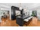 Spacious kitchen boasts large island with seating, stainless appliances, and custom cabinetry at 330 Tenney Circle, Chapel Hill, NC 27514