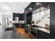 Modern kitchen with dark cabinets, stainless steel appliances, and white countertops at 330 Tenney Circle, Chapel Hill, NC 27514