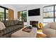 Comfortable living room showcasing a fireplace, large windows, and stylish seating arrangements at 330 Tenney Circle, Chapel Hill, NC 27514