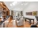Inviting living room with built-in shelving, comfortable seating, hardwood floors, and a large window offering natural light at 330 Tenney Circle, Chapel Hill, NC 27514