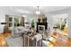Spacious living room showcasing hardwood floors, a fireplace, comfortable seating, and lots of natural light at 330 Tenney Circle, Chapel Hill, NC 27514