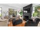 Cozy living room features a dark fireplace, large windows, and comfortable seating at 330 Tenney Circle, Chapel Hill, NC 27514