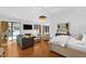 Open-concept living area featuring high ceilings, fireplace, television, plush seating, and natural light at 330 Tenney Circle, Chapel Hill, NC 27514