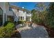 Outdoor patio area with chairs surrounded by lush landscaping and mature trees at 330 Tenney Circle, Chapel Hill, NC 27514