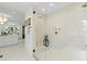 Luxurious glass enclosed shower with marble tiles, brass fixtures, and a built-in bench at 330 Tenney Circle, Chapel Hill, NC 27514