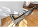 Bright foyer staircase featuring hardwood steps, iron railings and a modern aesthetic at 330 Tenney Circle, Chapel Hill, NC 27514