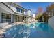 Refreshing swimming pool with crystal-clear water, surrounded by a well-maintained backyard and patio area at 330 Tenney Circle, Chapel Hill, NC 27514