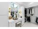 Bright closet and vanity area featuring updated fixtures, shelving and window for natural light at 330 Tenney Circle, Chapel Hill, NC 27514