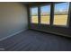 Bedroom with carpeted floors and three windows bringing in lots of natural light at 343 Magnolia Run Way, Benson, NC 27504