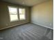 Bedroom with carpeted floors and two windows bringing in lots of natural light at 343 Magnolia Run Way, Benson, NC 27504
