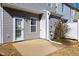 Private back patio with door to enter home and small side yard at 3931 Volkswalk Pl, Raleigh, NC 27610