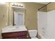 Bathroom with a combination shower and tub, nice vanity, and decorative mirror at 3931 Volkswalk Pl, Raleigh, NC 27610