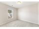 Inviting bedroom features neutral walls, carpet, and a large window with neighborhood views at 3931 Volkswalk Pl, Raleigh, NC 27610