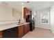 Charming kitchen featuring granite countertops, wooden cabinets, and stainless steel appliances at 3931 Volkswalk Pl, Raleigh, NC 27610