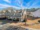 Exterior shot of townhomes with well-maintained landscaping, parking and inviting front porches at 3931 Volkswalk Pl, Raleigh, NC 27610