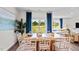 Bright dining room featuring a large window with a view, stylish furniture, and modern decor at 415 Swift Creek Farm Ln, Clayton, NC 27520