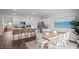 Open concept kitchen and dining area with white cabinetry, granite countertops, and stylish decor at 415 Swift Creek Farm Ln, Clayton, NC 27520