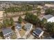 Aerial view of a neighborhood showcasing well-maintained homes and mature trees at 4207 Hampstead Village Dr, Durham, NC 27703