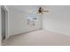 Bedroom with neutral carpet and a large window allowing ample natural light at 4207 Hampstead Village Dr, Durham, NC 27703
