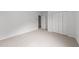 Neutral bedroom with carpet, closet and natural lighting at 4207 Hampstead Village Dr, Durham, NC 27703
