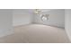 Spacious bedroom with a ceiling fan and a large window at 4207 Hampstead Village Dr, Durham, NC 27703