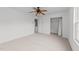 Carpeted bedroom with ceiling fan, closet, and an ensuite bathroom at 4207 Hampstead Village Dr, Durham, NC 27703