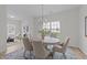 Cozy dining area with ample seating and stylish decor on luxury vinyl flooring at 4207 Hampstead Village Dr, Durham, NC 27703