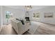 Cozy living room boasts natural light, fireplace, neutral palette and sleek flooring for a modern look at 4207 Hampstead Village Dr, Durham, NC 27703