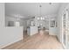Open-concept living area provides seamless flow between dining, kitchen, and living spaces perfect for entertaining at 4207 Hampstead Village Dr, Durham, NC 27703