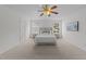 Bedroom with natural light, a ceiling fan, and plush carpeting at 4207 Hampstead Village Dr, Durham, NC 27703