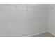 Neutral walk-in closet with wire shelving at 4207 Hampstead Village Dr, Durham, NC 27703