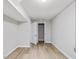 Finished basement with neutral walls and wood floors, closet space, and modern lighting at 427 Watson Rd, Efland, NC 27243