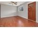 Bright living room featuring hardwood floors, neutral paint, and a ceiling fan at 427 Watson Rd, Efland, NC 27243
