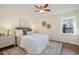 Comfortable bedroom filled with natural light, stylish decor, and a ceiling fan at 4705 Blue Bird Ct # C, Raleigh, NC 27606