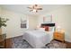 Bright bedroom featuring natural light, stylish decor, and a ceiling fan at 4705 Blue Bird Ct # C, Raleigh, NC 27606
