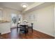 Charming dining area with a marble table, hardwood floors, and access to the patio at 4705 Blue Bird Ct # C, Raleigh, NC 27606