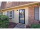Charming home featuring a welcoming front door, brick accents, and tasteful shutters at 4705 Blue Bird Ct # C, Raleigh, NC 27606