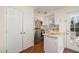 Efficient kitchen featuring stainless steel appliances, white cabinets, and a convenient layout at 4705 Blue Bird Ct # C, Raleigh, NC 27606