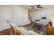 Open-concept living area with beautiful hardwood floors, neutral tones, and staircase access at 4705 Blue Bird Ct # C, Raleigh, NC 27606