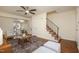 Open-concept living room featuring beautiful floors, a staircase, and ample natural light at 4705 Blue Bird Ct # C, Raleigh, NC 27606