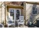 Inviting outdoor patio with comfortable wicker chairs, perfect for relaxing and enjoying the fresh air at 4705 Blue Bird Ct # C, Raleigh, NC 27606