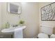 Cozy powder room features a pedestal sink and decorative accents at 4705 Blue Bird Ct # C, Raleigh, NC 27606