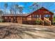 Backyard featuring an expansive wooden deck area with stairs and mature trees at 6312 New Market Way, Raleigh, NC 27615